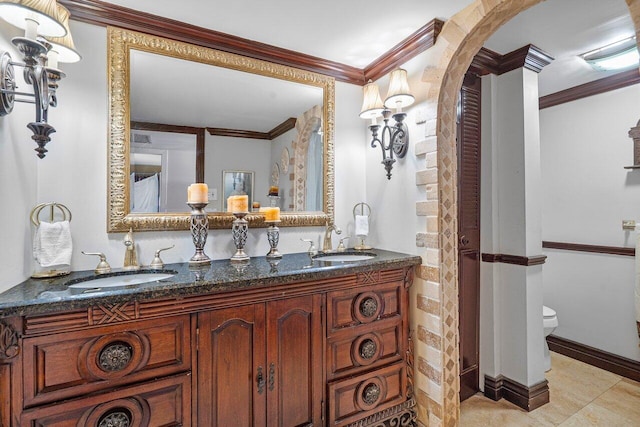 bathroom featuring tile patterned floors, vanity, toilet, and ornamental molding