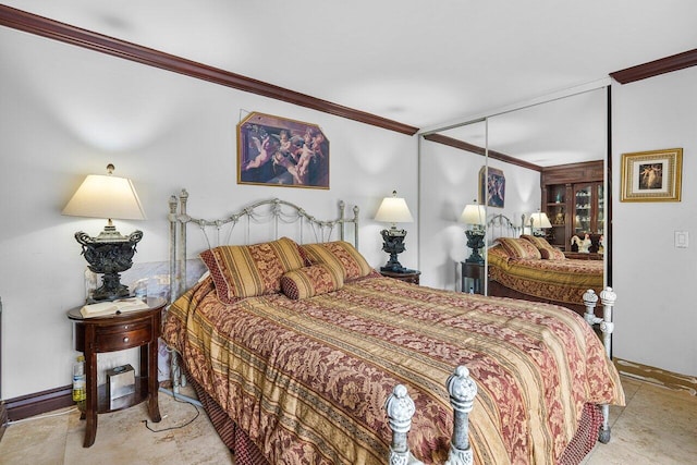 bedroom with crown molding and a closet