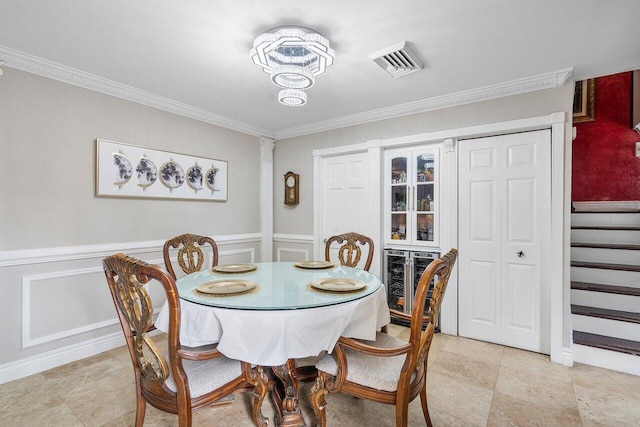 dining space with wine cooler and crown molding