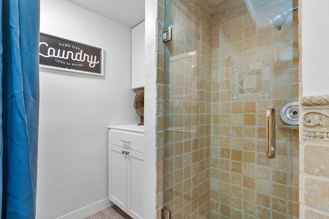 bathroom featuring a shower with door