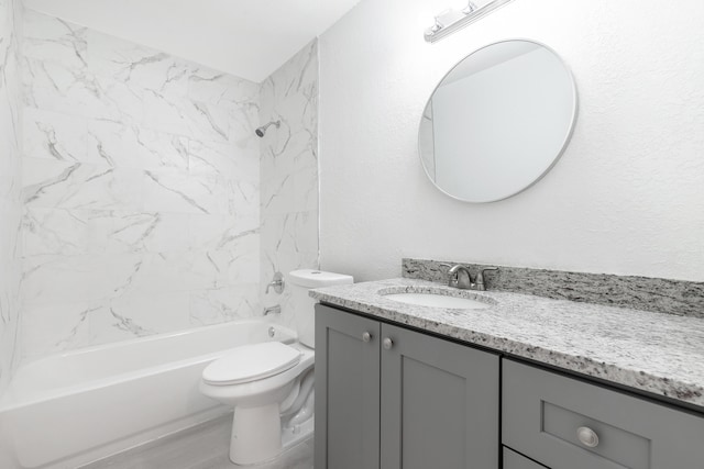 full bathroom featuring tiled shower / bath combo, vanity, toilet, and hardwood / wood-style flooring