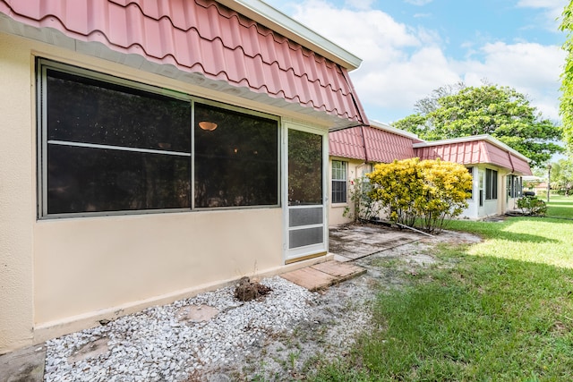 view of home's exterior with a yard