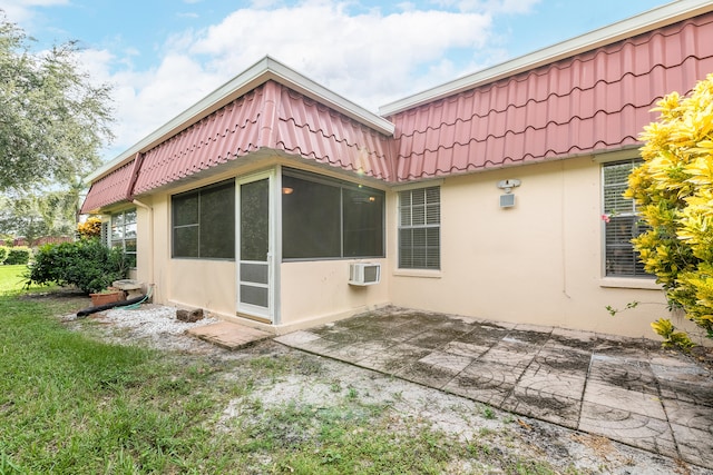 rear view of property featuring a patio