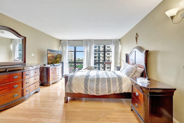 bedroom with light wood-type flooring