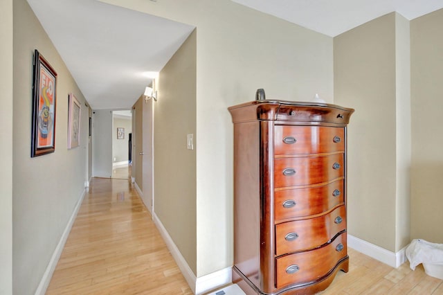 hall with light hardwood / wood-style floors