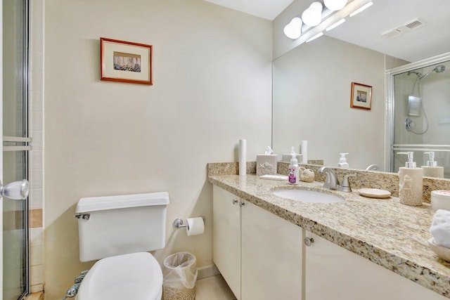 bathroom featuring walk in shower, vanity, and toilet