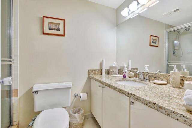 18181 NE 31st Ct Unit 1408, Aventura, FL 33160 - full bath with toilet, vanity, visible vents, and a stall shower