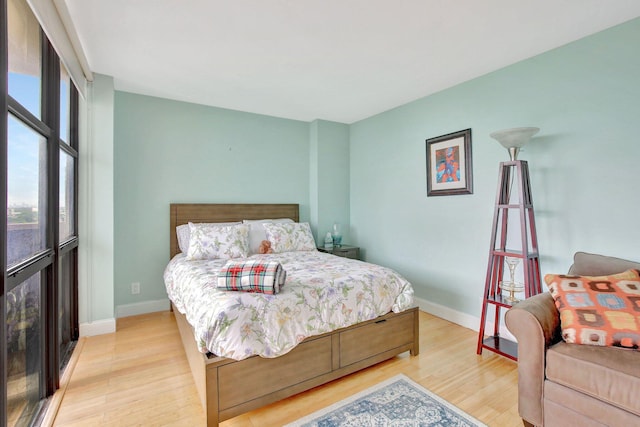 bedroom with light wood-type flooring