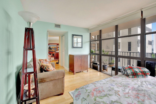 bedroom with light hardwood / wood-style flooring