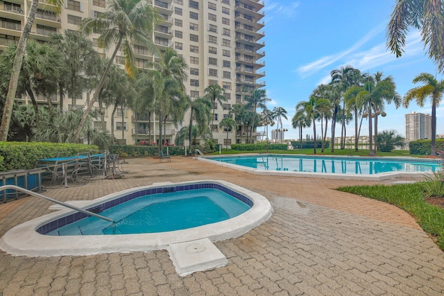 view of swimming pool featuring a patio area