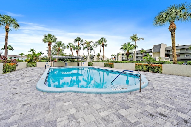 view of pool featuring a patio