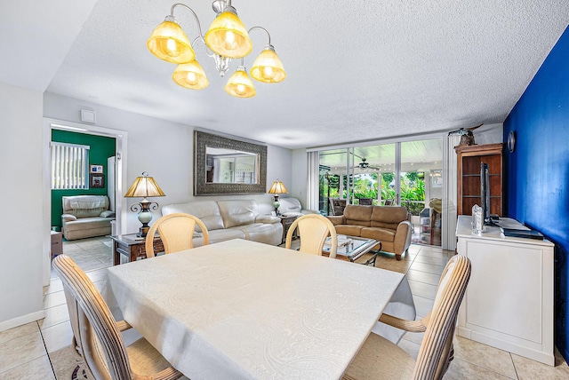 dining room with floor to ceiling windows, a chandelier, light tile patterned floors, and a textured ceiling