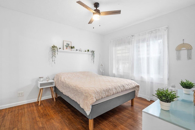 bedroom featuring ceiling fan and dark hardwood / wood-style floors