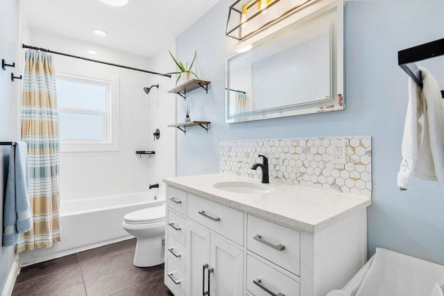 full bathroom featuring tile patterned floors, toilet, decorative backsplash, shower / tub combo with curtain, and vanity