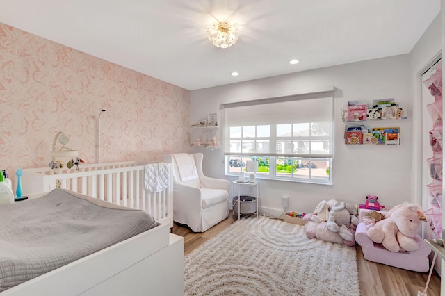 bedroom with light hardwood / wood-style flooring