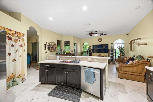 kitchen featuring light tile patterned floors, stainless steel dishwasher, ceiling fan, and sink