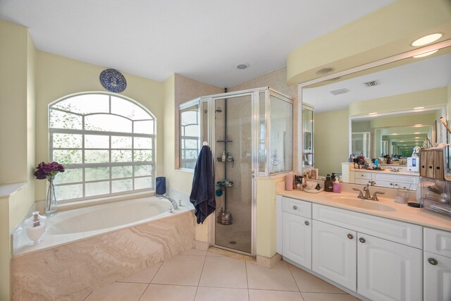 bathroom featuring vanity, separate shower and tub, and tile patterned floors