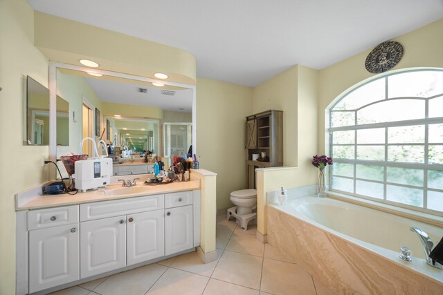 full bathroom with plus walk in shower, tile patterned flooring, vanity, and toilet