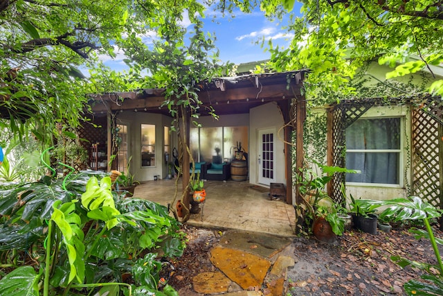 rear view of house with a patio