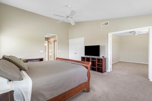 carpeted bedroom with a textured ceiling, high vaulted ceiling, and ceiling fan