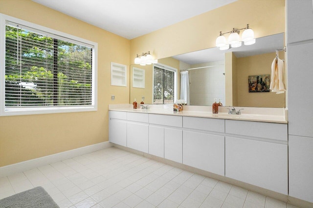 bathroom with vanity, tile patterned floors, and a shower with shower curtain