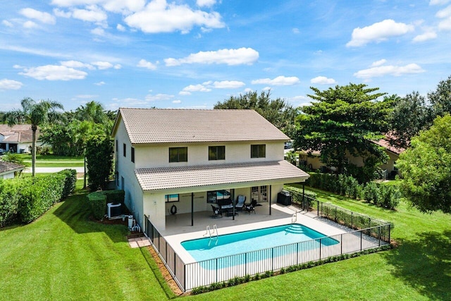 rear view of house with a fenced in pool, a patio area, central AC unit, and a lawn