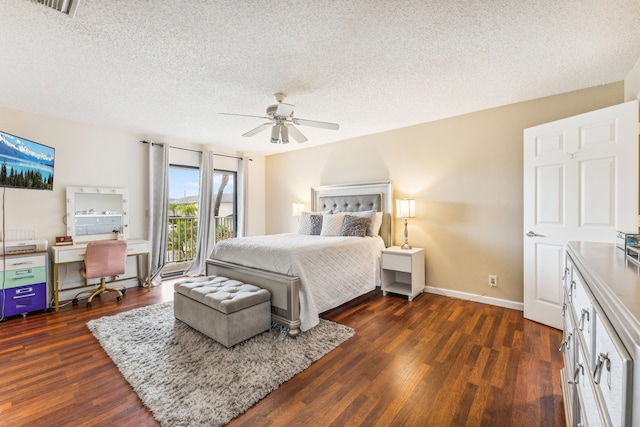 bedroom featuring ceiling fan, a textured ceiling, and dark hardwood / wood-style floors