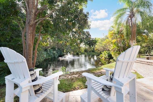 view of patio featuring a water view