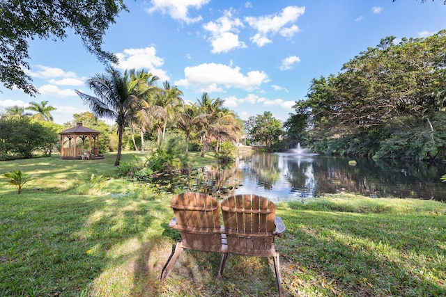 view of yard featuring a gazebo and a water view