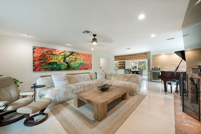 living room with light wood-type flooring and ceiling fan