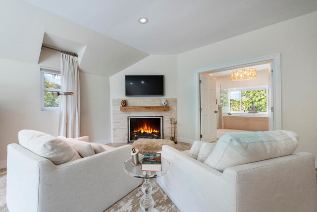 living room with an inviting chandelier and plenty of natural light