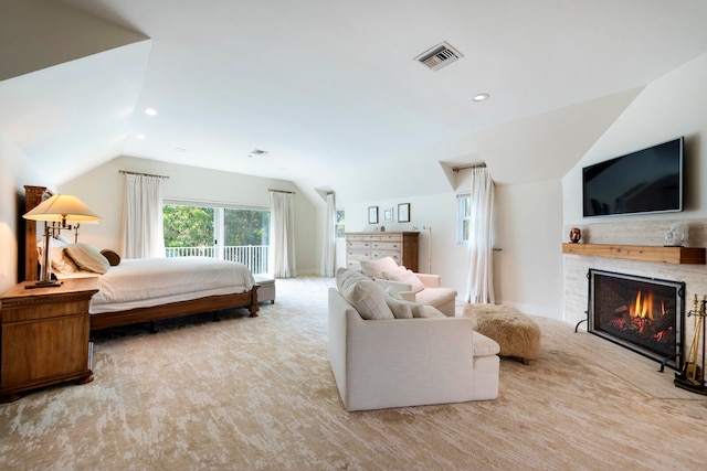 carpeted bedroom with lofted ceiling