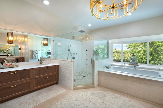 bathroom with separate shower and tub and vanity