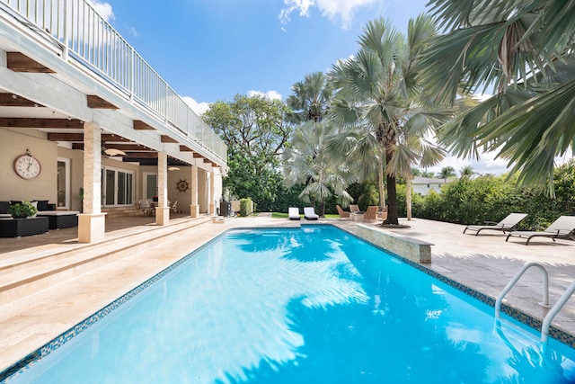 view of swimming pool with an outdoor hangout area, a patio, and ceiling fan