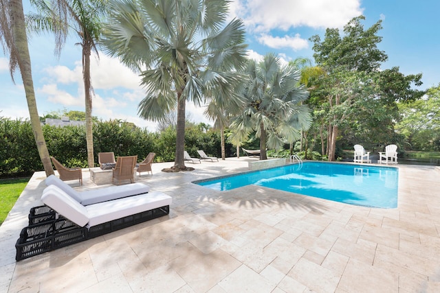 view of pool with a patio area