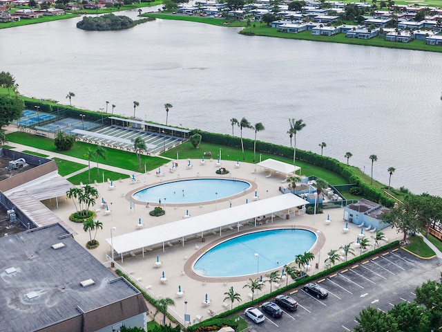 birds eye view of property featuring a water view