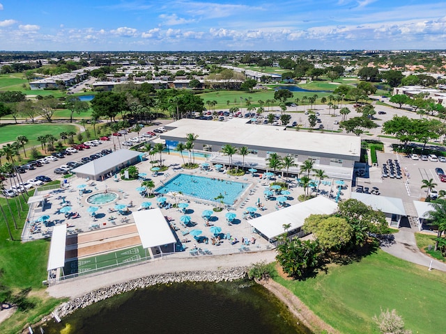 birds eye view of property with a water view