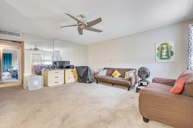 living room featuring ceiling fan and light colored carpet