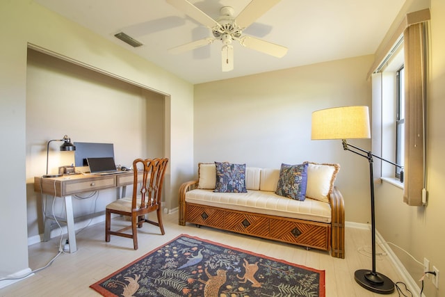 office with ceiling fan and light wood-type flooring