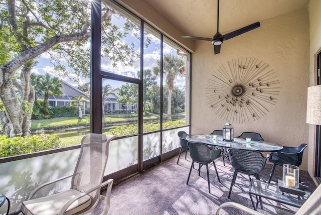 sunroom / solarium with ceiling fan