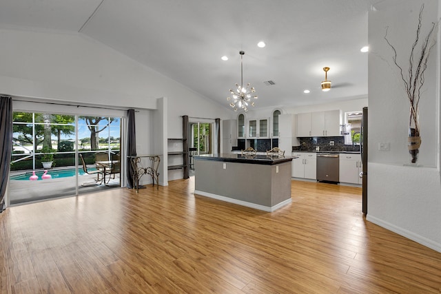 kitchen featuring dishwasher, pendant lighting, light hardwood / wood-style flooring, and white cabinetry