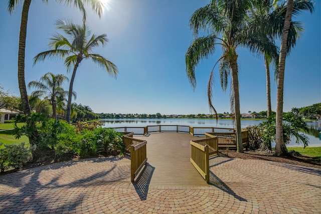 surrounding community featuring a water view