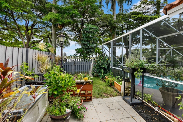 view of patio / terrace featuring a fenced in pool and a lanai