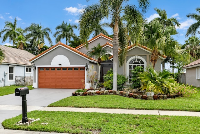 mediterranean / spanish-style home featuring a garage and a front lawn