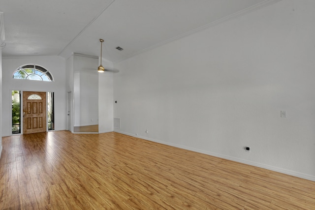 foyer with ceiling fan, light wood-type flooring, and high vaulted ceiling