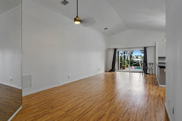 unfurnished living room featuring ceiling fan, ornamental molding, lofted ceiling, and hardwood / wood-style floors