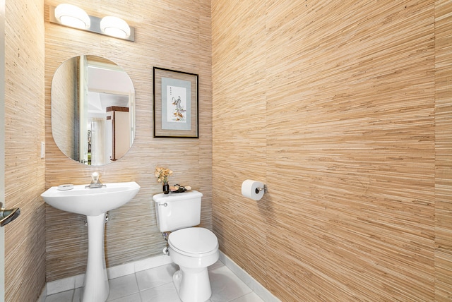 bathroom with sink, tile patterned flooring, and toilet