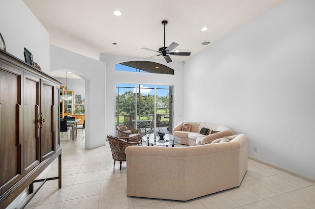 tiled living room with ceiling fan