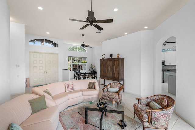 living room with light tile patterned flooring and ceiling fan