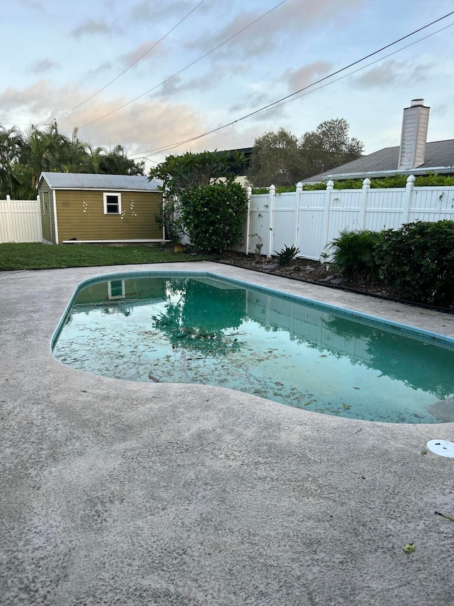 view of pool with an outdoor structure